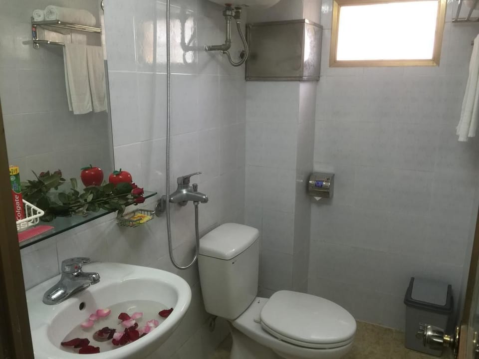 Shower, free toiletries, hair dryer, slippers