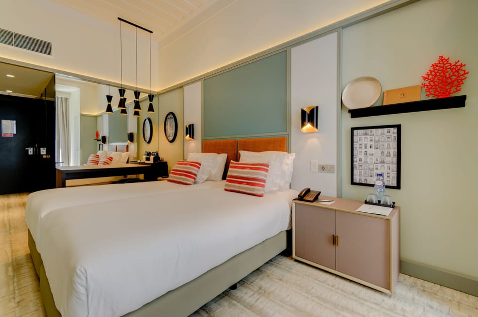 Premium bedding, down comforters, minibar, in-room safe