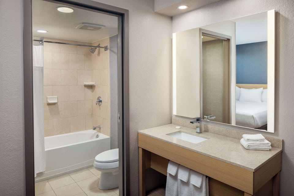 Rainfall showerhead, designer toiletries, hair dryer, towels