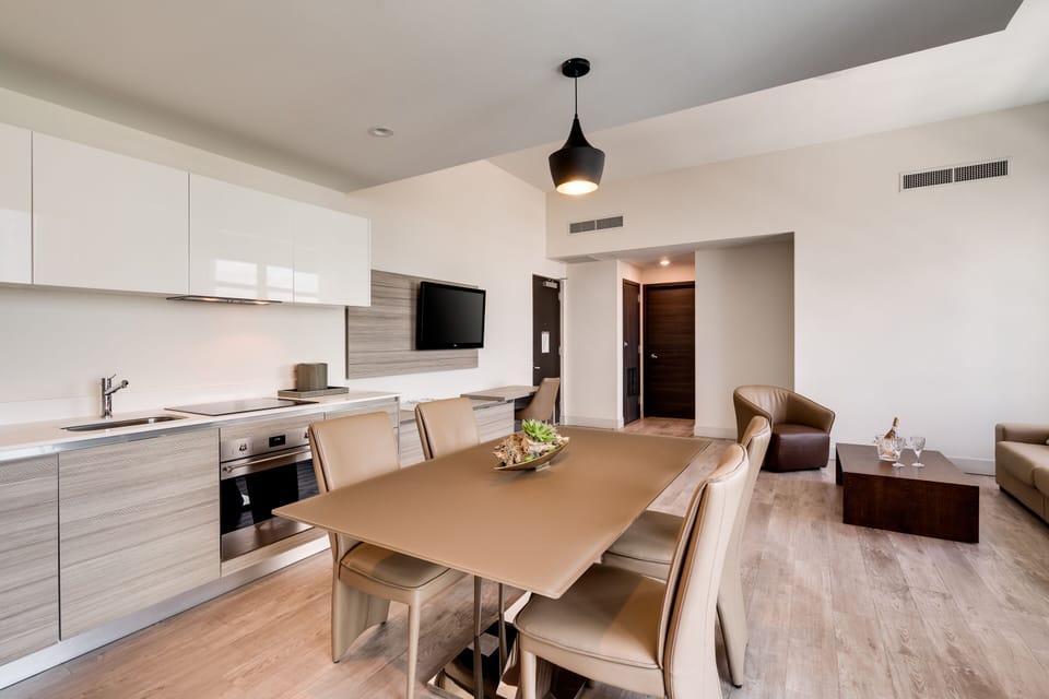 One Bedroom Suite Queen Water View | Living area | 39-inch flat-screen TV with cable channels, TV