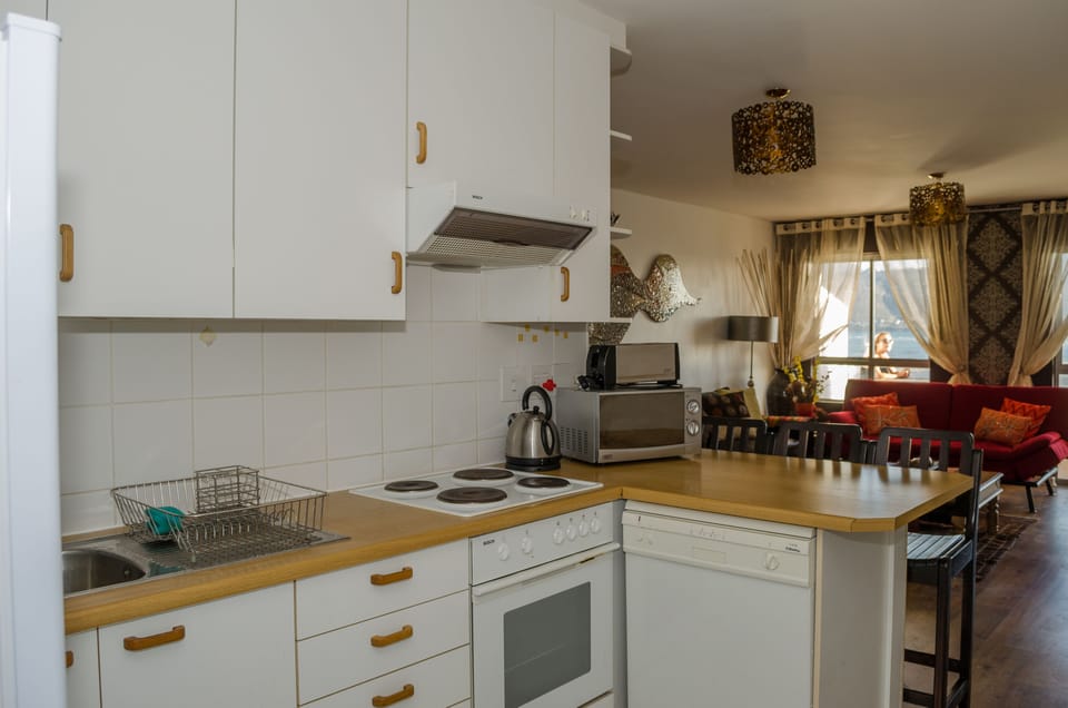 Design Apartment, Sea View | Private kitchen | Fridge, microwave, oven, stovetop