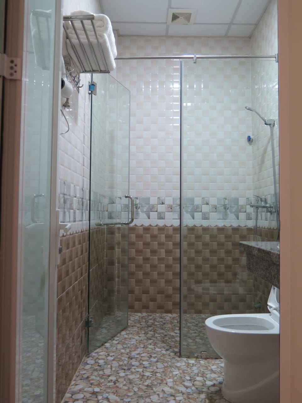 Shower, free toiletries, hair dryer, slippers