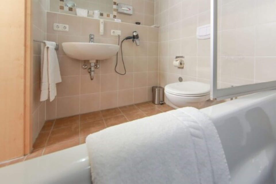 Deep soaking tub, rainfall showerhead, hair dryer, bathrobes