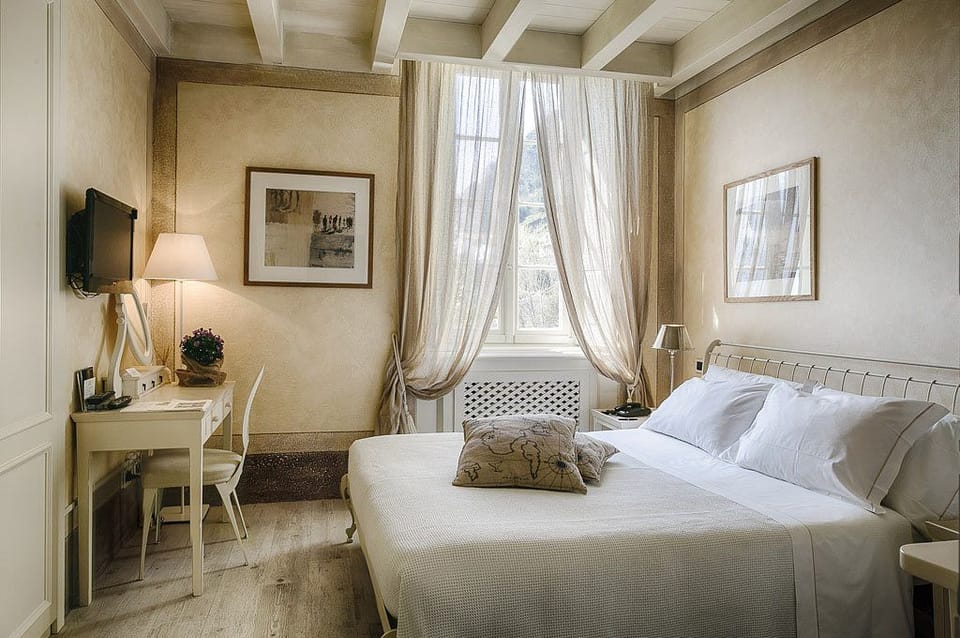 Classic Double Room, Partial Lake View | Hypo-allergenic bedding available, minibar, in-room safe, desk