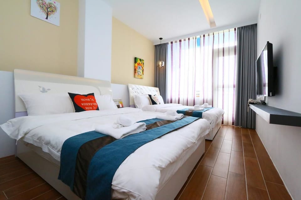 Standard Quadruple Room, Non Smoking | Desk, laptop workspace, blackout drapes, soundproofing