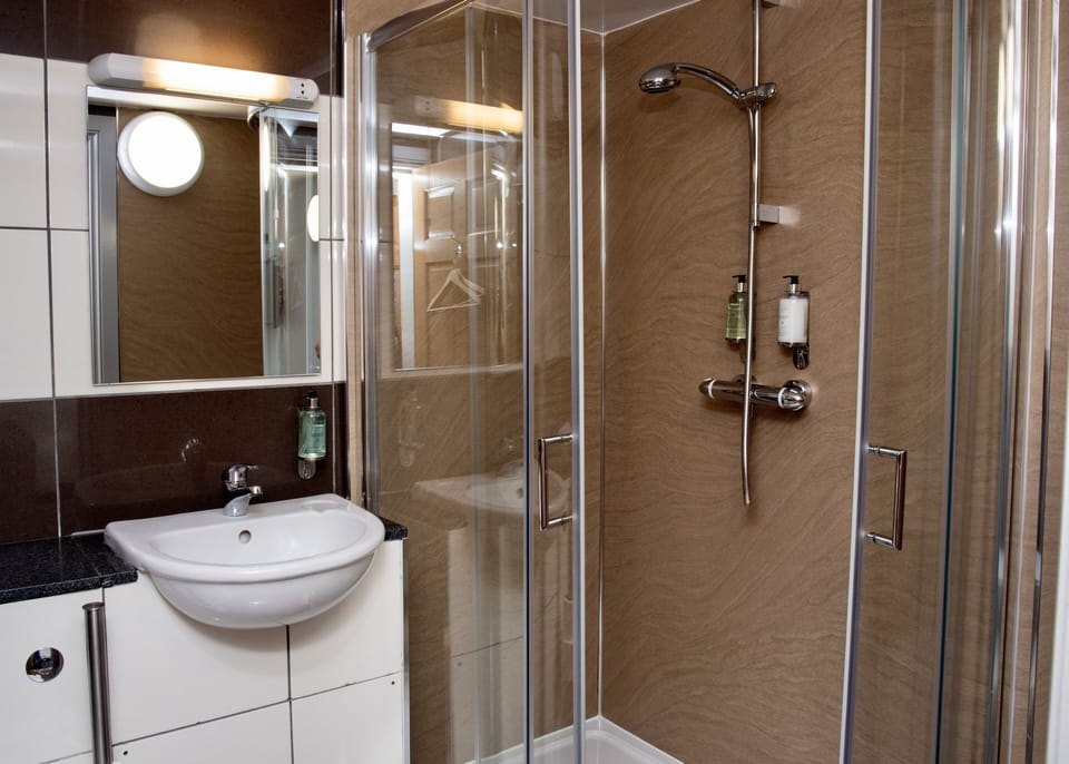 Designer toiletries, hair dryer, towels