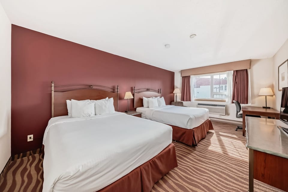 Room, 2 Queen Beds, Refrigerator & Microwave | Iron/ironing board, WiFi (free), bed sheets