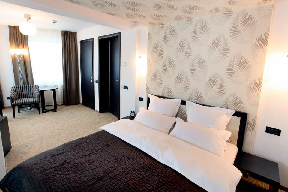 Junior Suite, River View | Minibar, desk, soundproofing, iron/ironing board