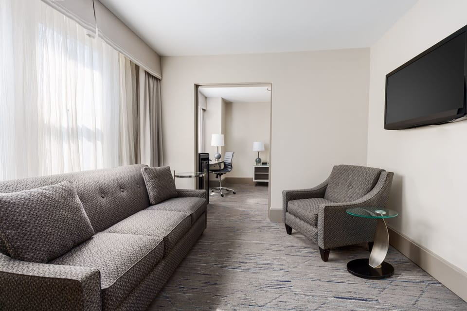 Suite, 1 King Bed with Sofa bed | In-room safe, individually furnished, desk, laptop workspace
