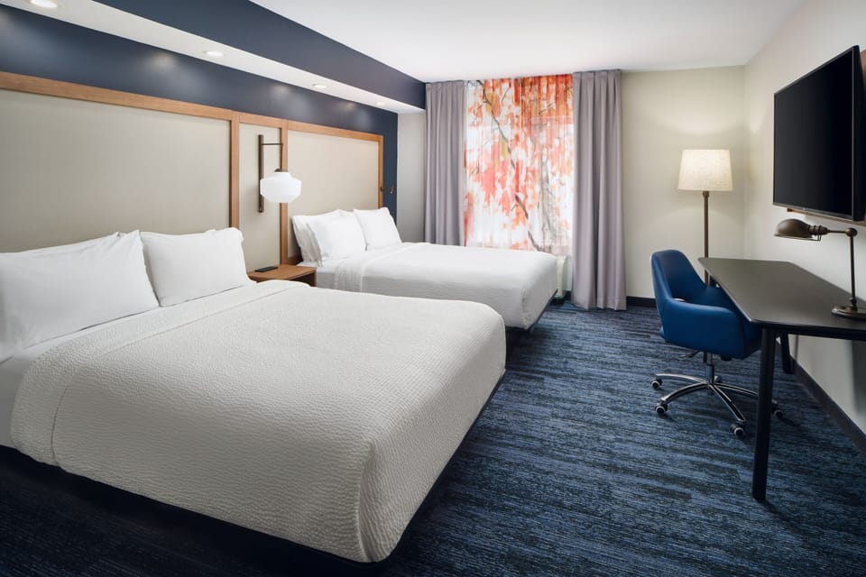 Suite, Multiple Beds | Desk, laptop workspace, blackout drapes, iron/ironing board