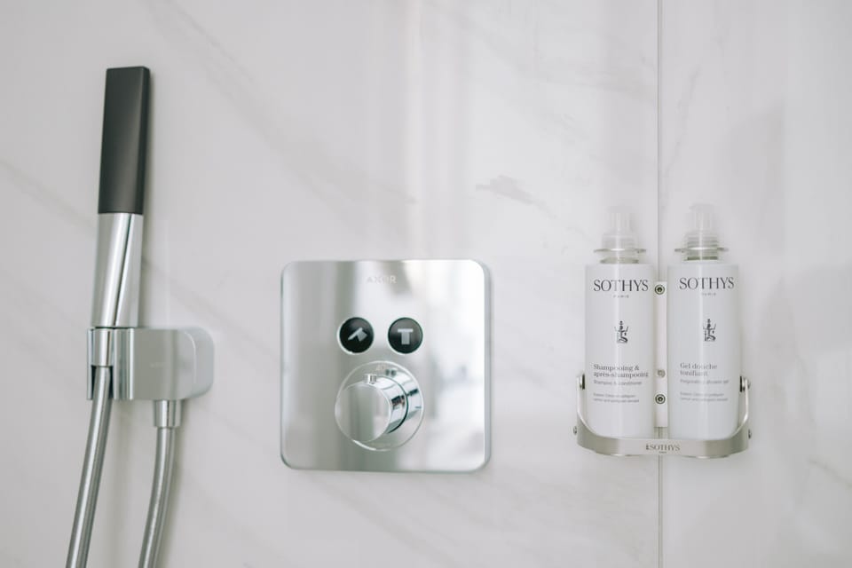 Shower, eco-friendly toiletries, hair dryer, slippers