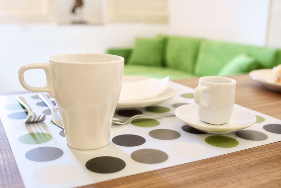 Design Suite, Kitchen | Breakfast area | Daily buffet breakfast for a fee