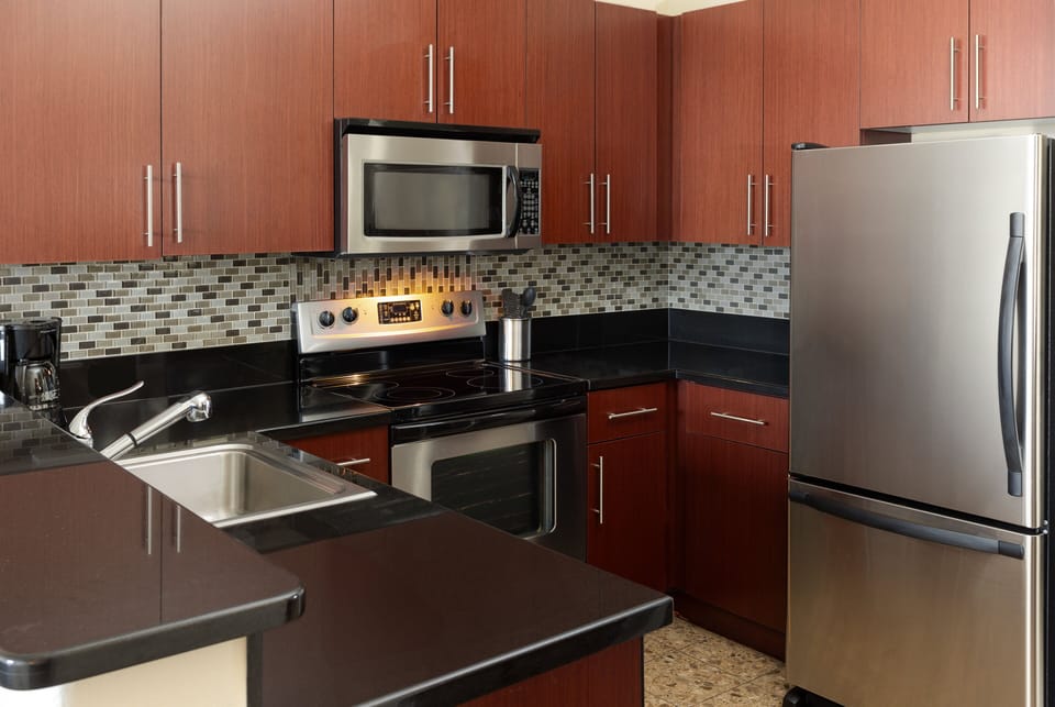 Suite, 1 Bedroom, Kitchen, City View | Desk, iron/ironing board, free cribs/infant beds, free rollaway beds