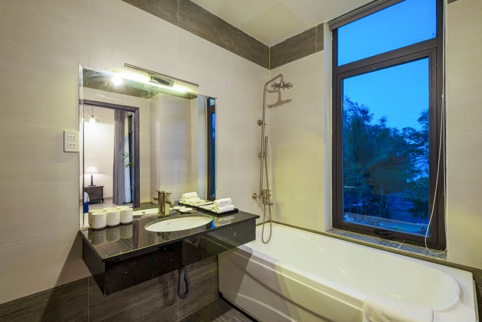 Shower, rainfall showerhead, designer toiletries, hair dryer