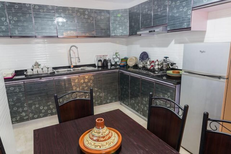 Apartment, 3 Bedrooms | Private kitchen | Full-size fridge, stovetop, cookware/dishes/utensils
