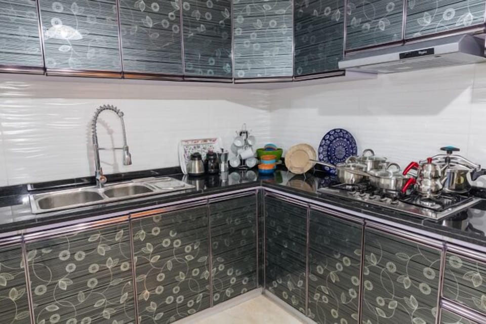 Apartment, 3 Bedrooms | Private kitchen | Full-size fridge, stovetop, cookware/dishes/utensils