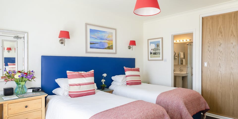 Desk, iron/ironing board, free cribs/infant beds, rollaway beds