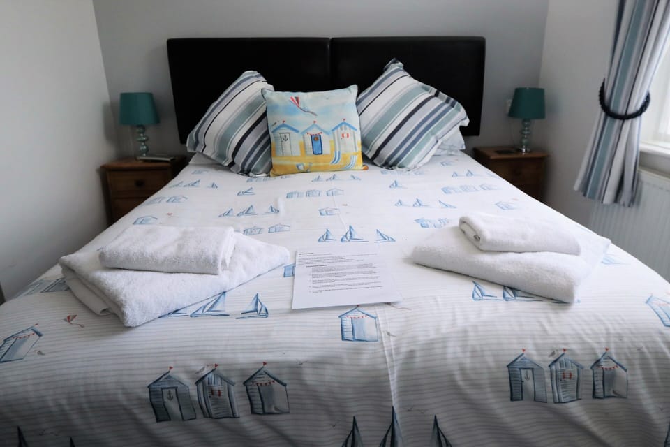 Premium bedding, blackout drapes, iron/ironing board, free WiFi