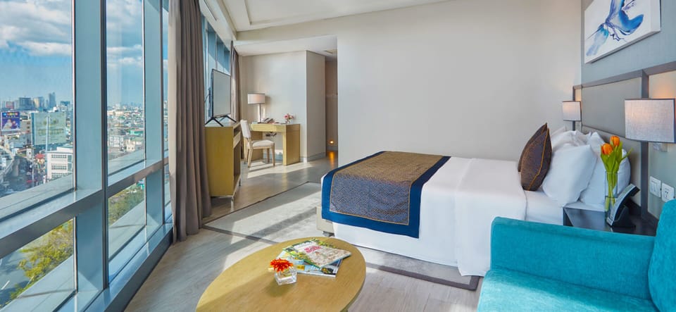 Runway Corner Suite with Airport View | Minibar, in-room safe, blackout drapes, free WiFi
