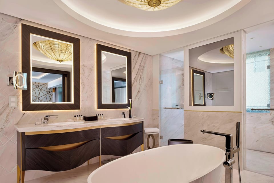 Presidential Suite, 1 King Bed | Bathroom | Separate tub and shower, rainfall showerhead, designer toiletries