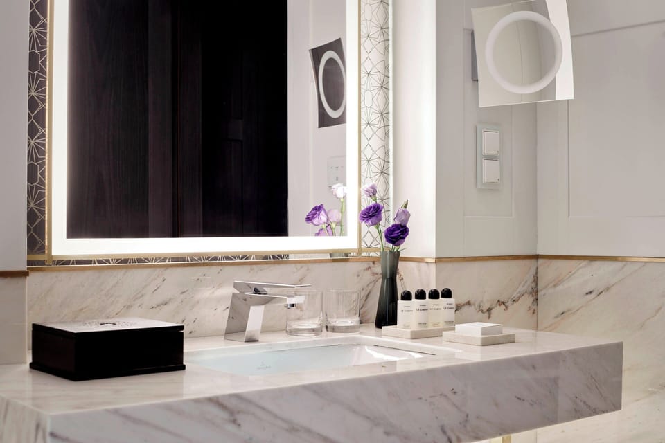 Separate tub and shower, rainfall showerhead, designer toiletries