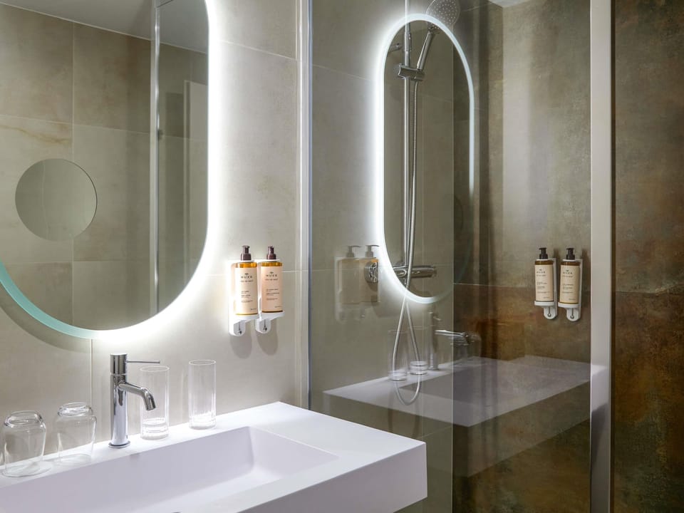 Bathtub, eco-friendly toiletries, hair dryer, towels