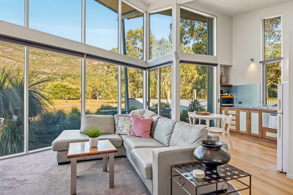 Luxury Chalet (Bushland Luxury Couples Retreat) | Living area | Flat-screen TV, fireplace, DVD player