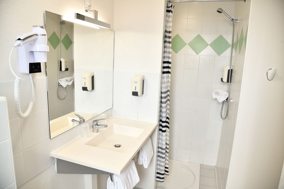 Shower, rainfall showerhead, eco-friendly toiletries, hair dryer