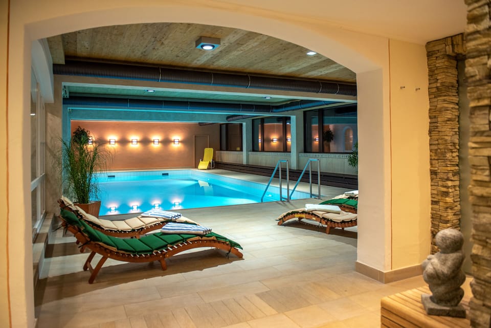 Indoor pool, open 8:00 AM to 8:30 PM, pool umbrellas, sun loungers