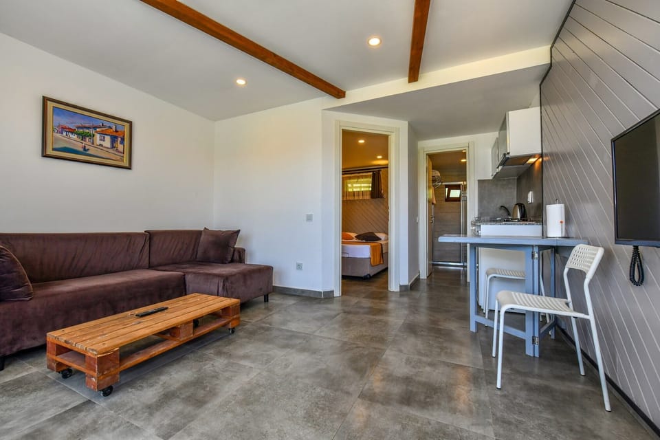 Standard Villa, 1 Bedroom, Kitchenette, Garden Area | 1 bedroom, desk, soundproofing, iron/ironing board