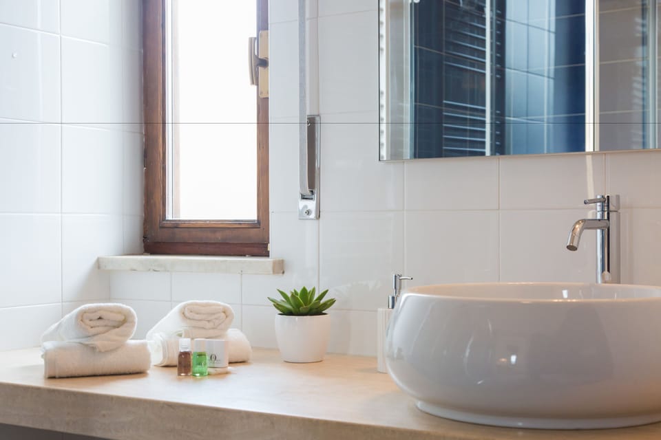 Luxury Quadruple Room, 2 Bedrooms, Balcony, Garden View | Bathroom | Shower, free toiletries, hair dryer, bathrobes