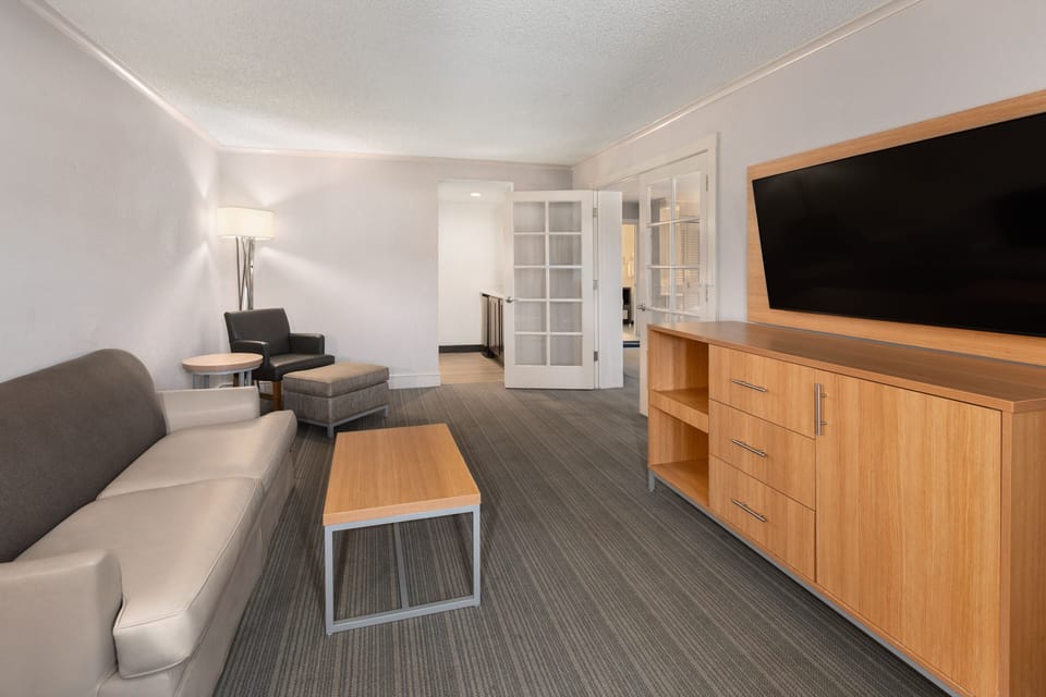 Premium bedding, desk, laptop workspace, iron/ironing board