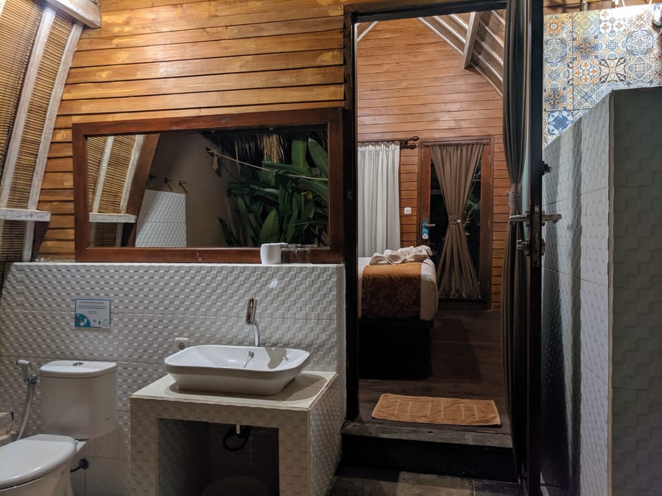 Shower, rainfall showerhead, hair dryer (on request), slippers