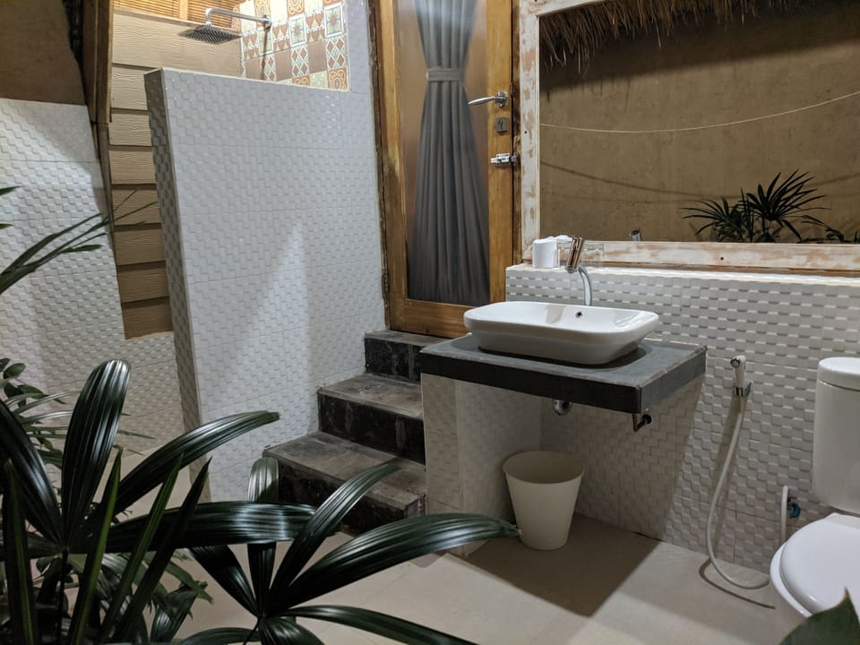 Shower, rainfall showerhead, hair dryer (on request), slippers