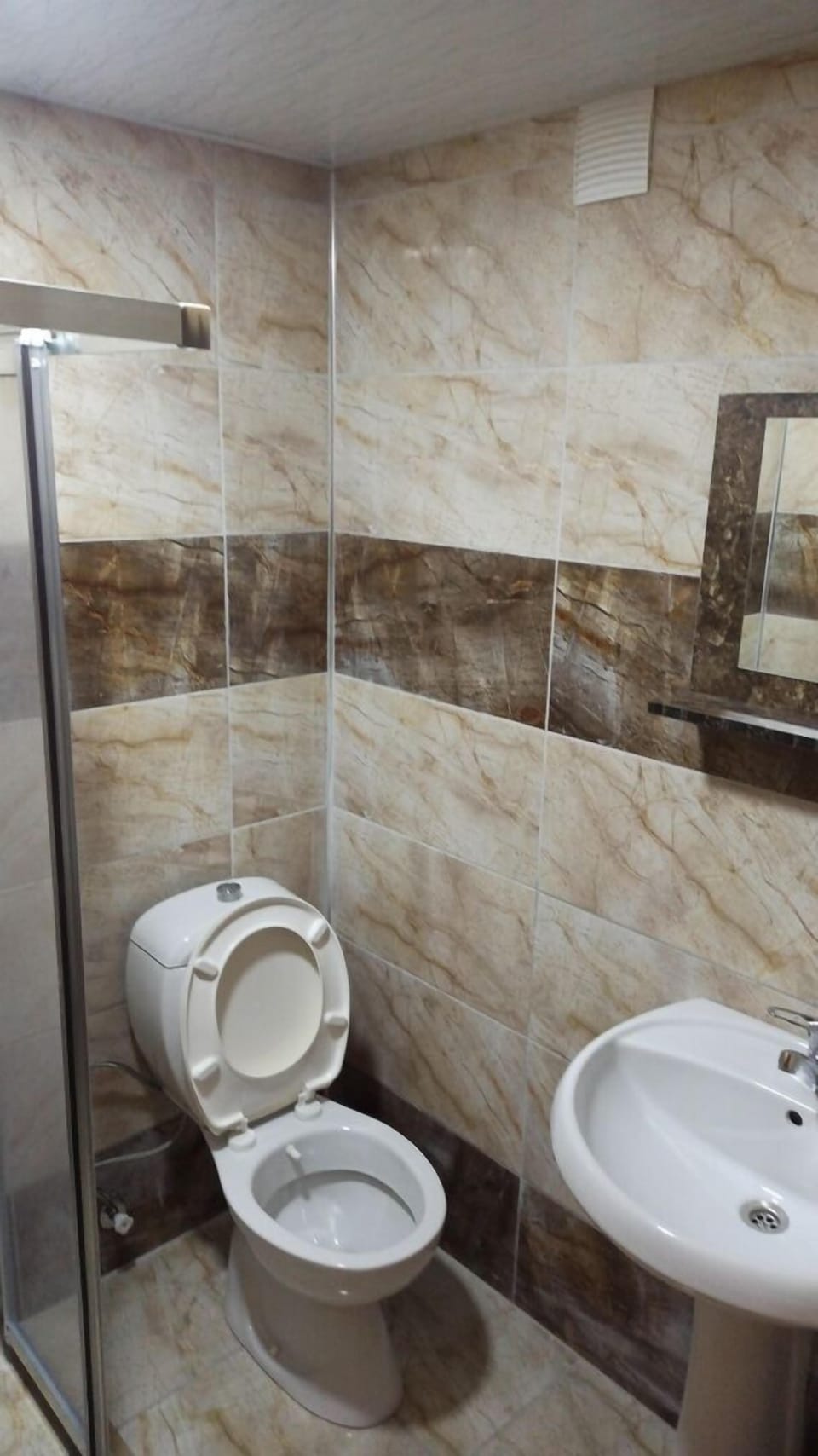 Shower, free toiletries, hair dryer, slippers