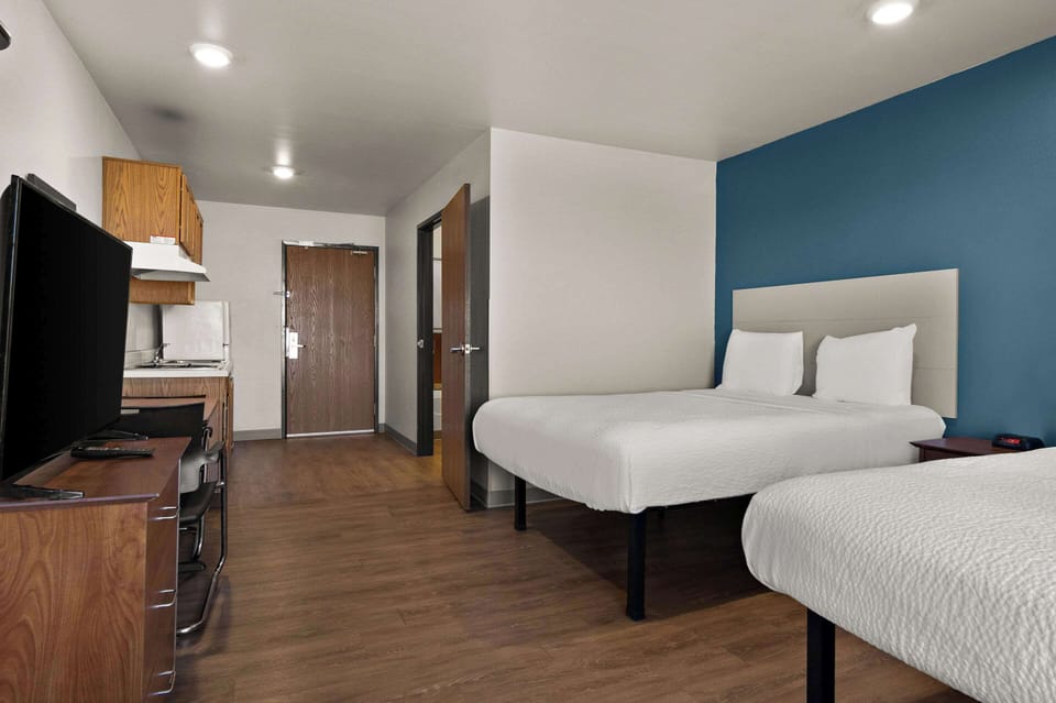 Suite, 2 Queen Beds, Accessible, Non Smoking (Efficiency) | Desk, laptop workspace, iron/ironing board, free WiFi