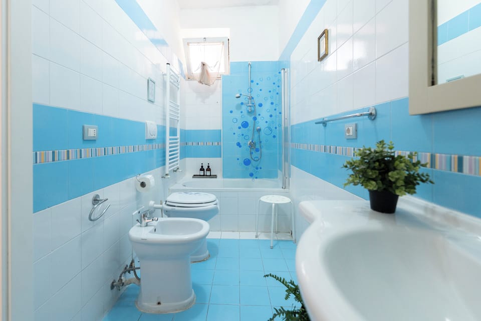 Deluxe Quadruple Room, Terrace | Bathroom | Rainfall showerhead, free toiletries, hair dryer, bidet