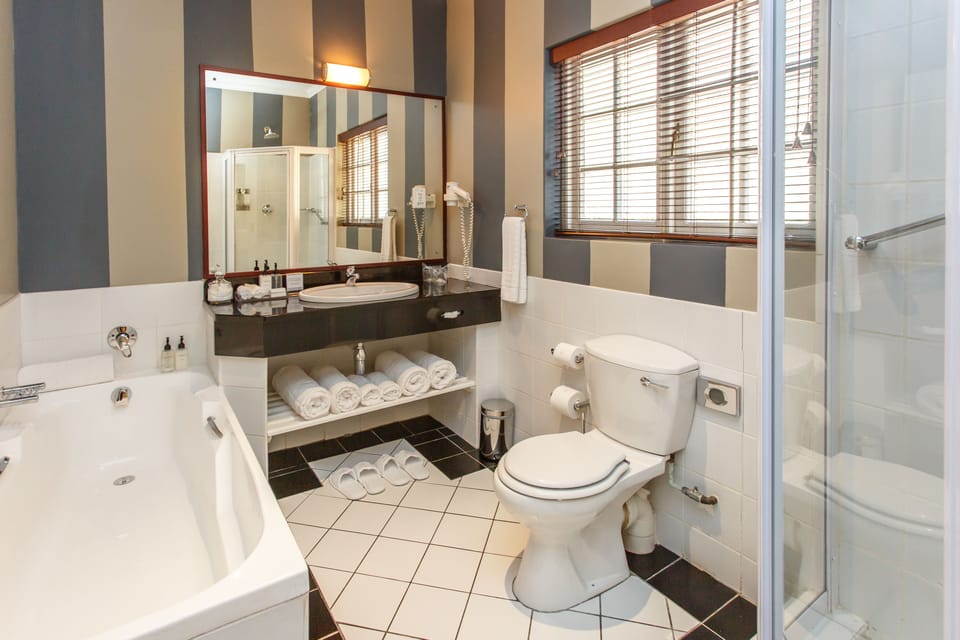 Luxury Room, 1 King Bed | Bathroom | Separate tub and shower, free toiletries, hair dryer, bathrobes