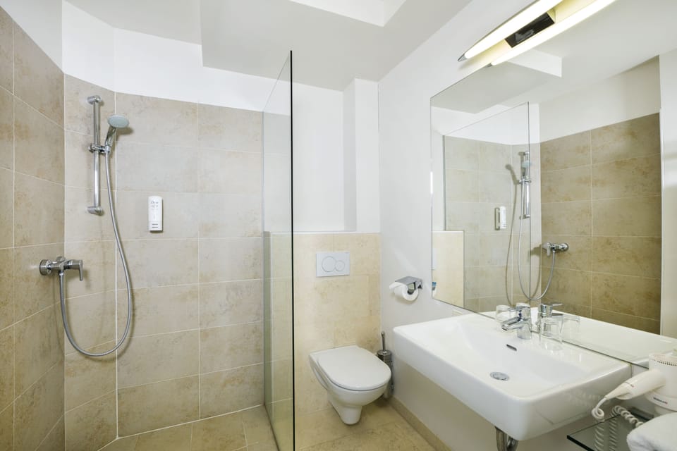 Shower, free toiletries, hair dryer, towels