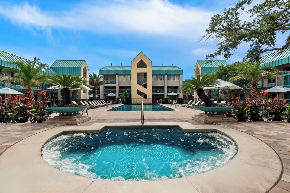 Outdoor pool, open 10:00 AM to 10:00 PM, pool umbrellas, sun loungers