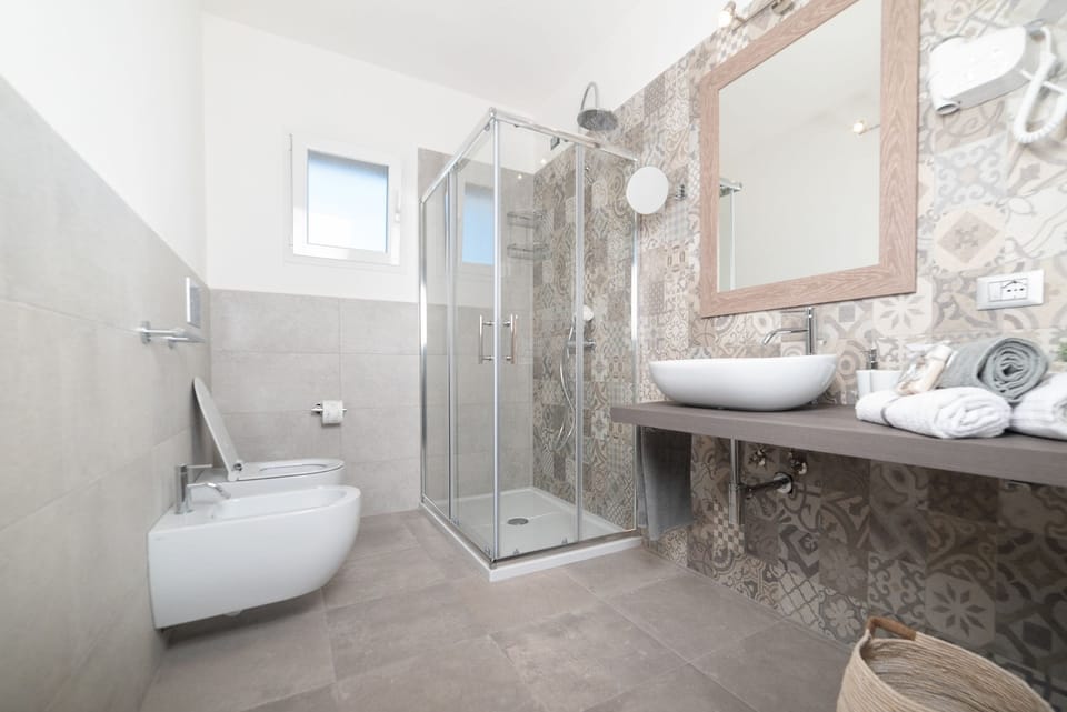 Shower, eco-friendly toiletries, hair dryer, bidet