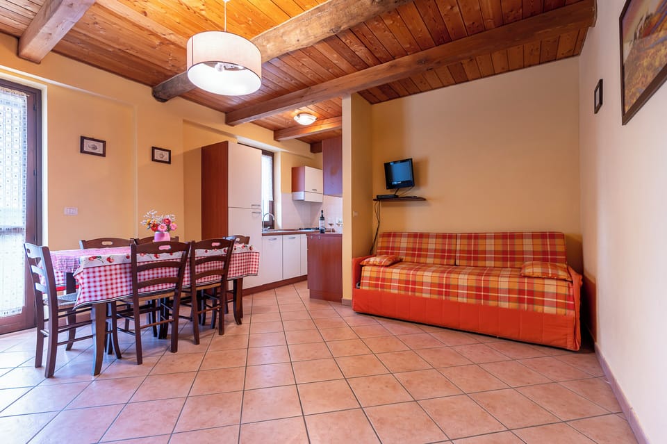 Family Apartment, 1 Bedroom, Balcony, Hill View (4 pax) | Living area | Flat-screen TV