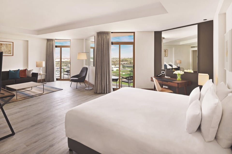 Resort View Junior Suite, Peacock Lounge, Beach & Splash Park | Minibar, in-room safe, desk, laptop workspace