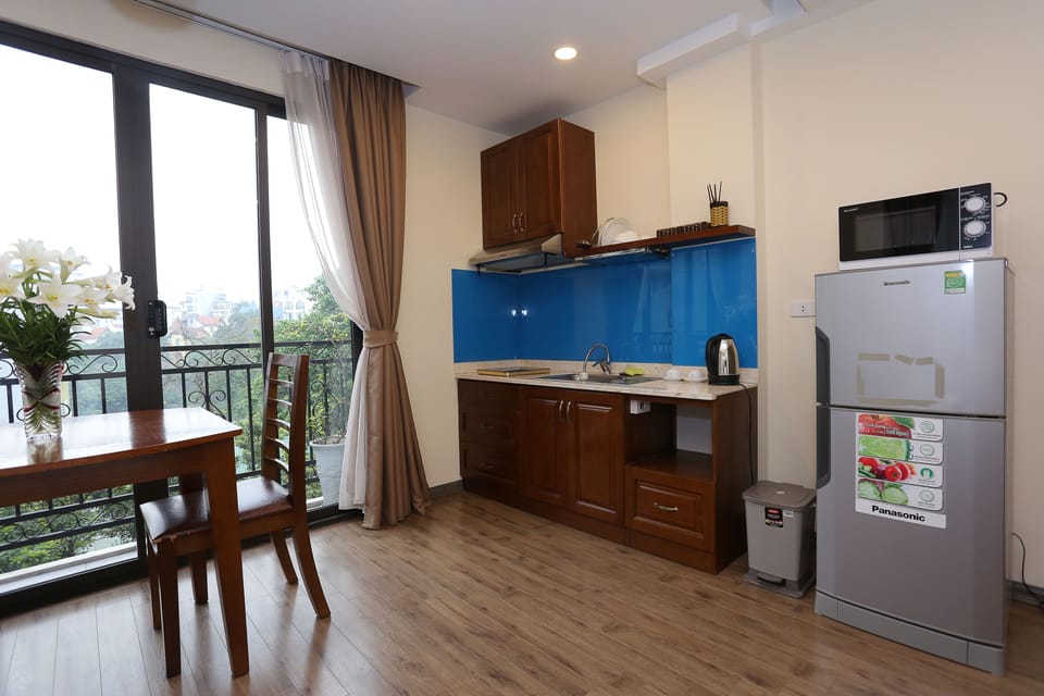 Apartment, Balcony | Private kitchenette | Fridge, microwave, stovetop, dishwasher