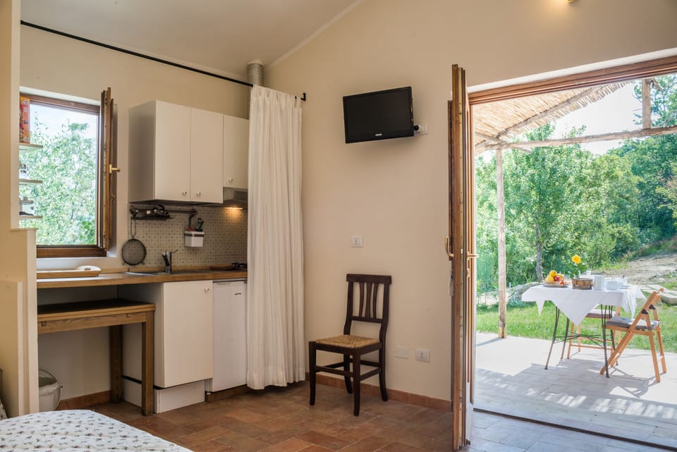 Deluxe Studio, 1 Bedroom (Il Bagno Santo) | Private kitchenette | Full-size fridge, oven, stovetop, dishwasher