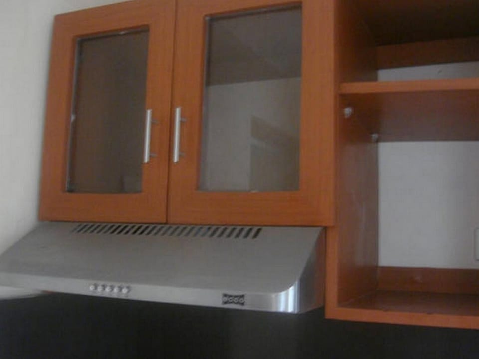 Full-size fridge, stovetop, electric kettle, rice cooker