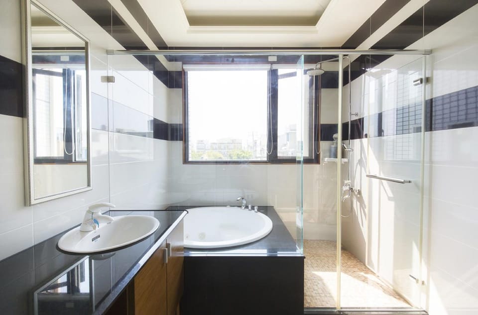 Deluxe Quadruple Room, Lanai | Bathroom | Shower, free toiletries, hair dryer, slippers