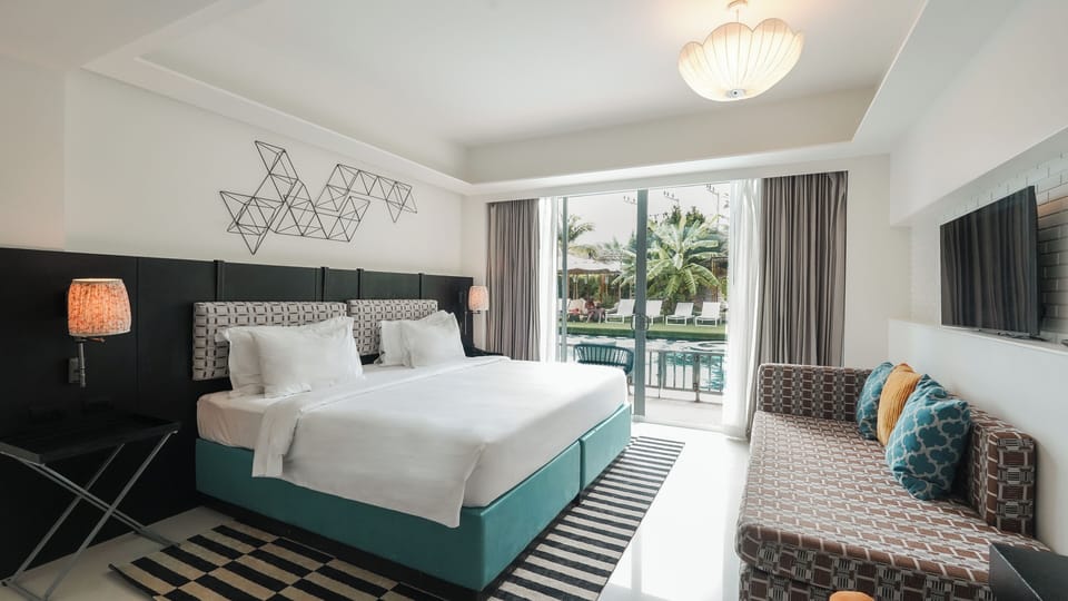 Deluxe Room, Pool Access | In-room safe, individually decorated, desk, laptop workspace