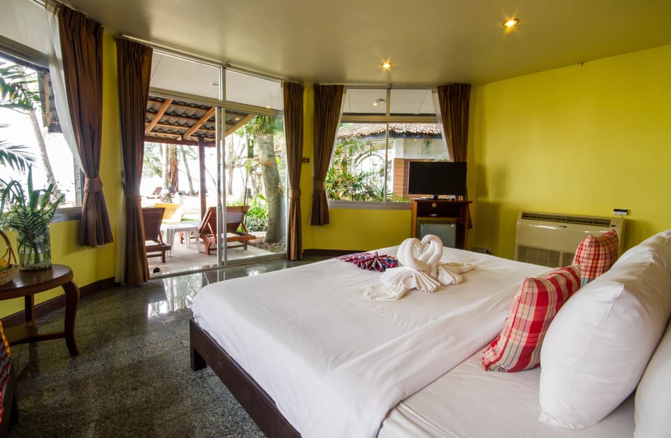 Deluxe Bungalow, Beach View | In-room safe, desk, blackout drapes, iron/ironing board (on request)