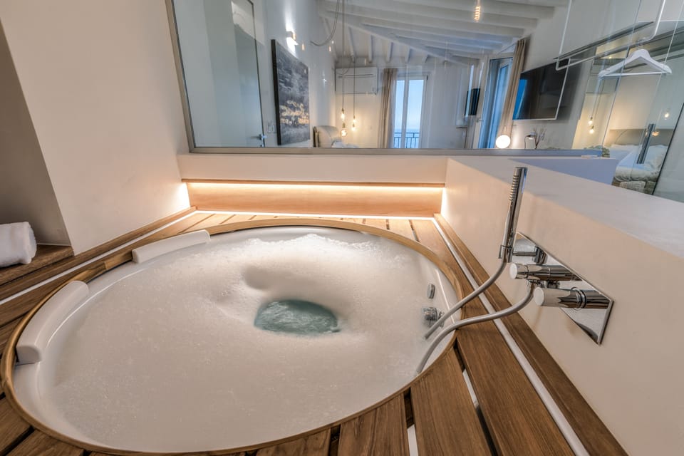 Honeymoon Suite, Jetted Tub | Bathroom | Designer toiletries, hair dryer, slippers, bidet